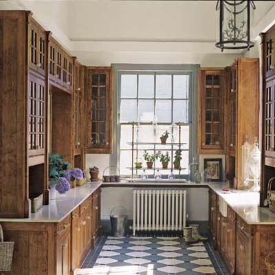 Garden room has cherry cabiets and geometric tiles 