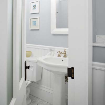 pedestal sink and toilet seen from hallway