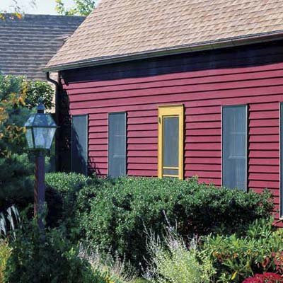 house with stained red siding