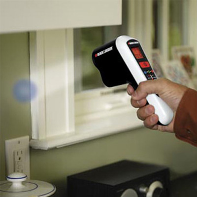 man using thermal detector to save energy