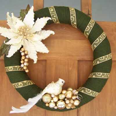 green yarn wreath with gold embellishments 