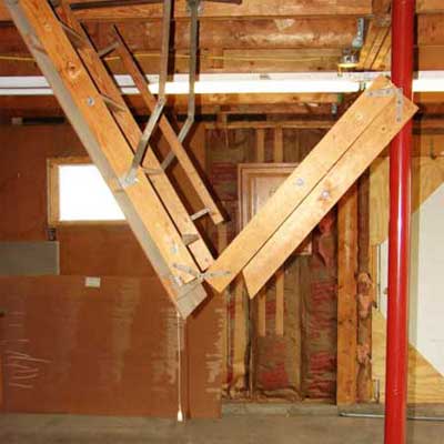 pull down ladder installed in a garage where it can't open fully