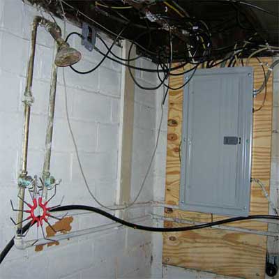 working open shower installed less than three feet from a working electrical panel 