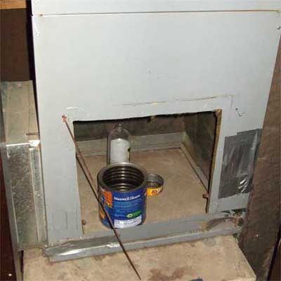 coffee can of potpourri sitting inside a furnace