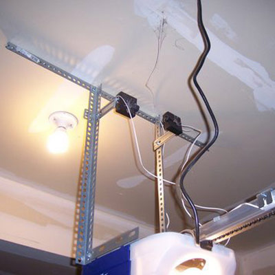 garage door safety sensors installed on ceiling in home inspection