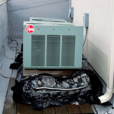 mattress folded under a compressor seen in home inspection