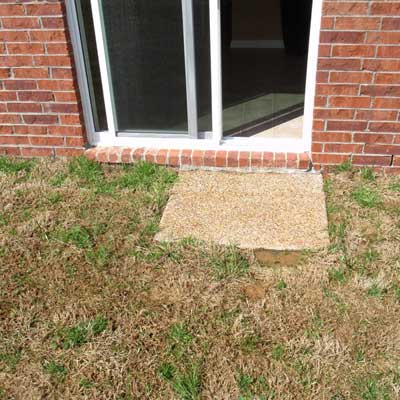 patio with just one patio stone seen on home inspection