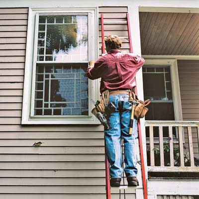 man working on extension ladder
