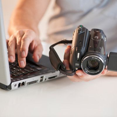 man videotaping house for insurance