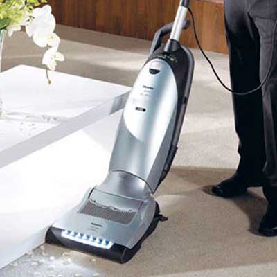 vacuum in use cleaning a carpet