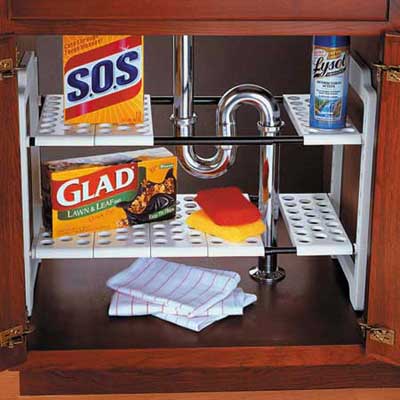 a collection of cleaning materials below a sink