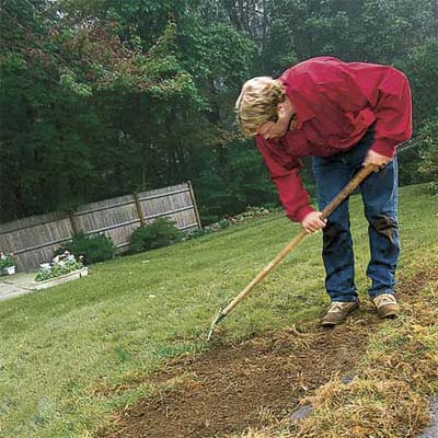 man working on his lawn