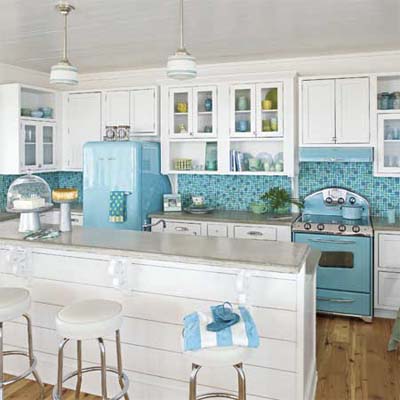 white and blue kitchen with island, blue tile, blue appliances and stools