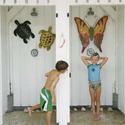 side by side outdoor shower stalls in use