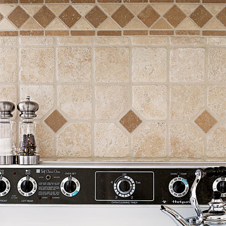 backsplash made with leftover tiles built into this budget remodeled custom kitchen