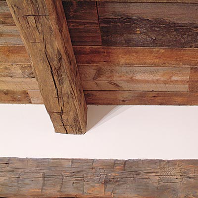 salvaged wooden beams in old world style kitchen