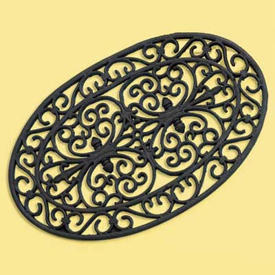 rubber doormat decorated to in a faux iron work design; welcome mat