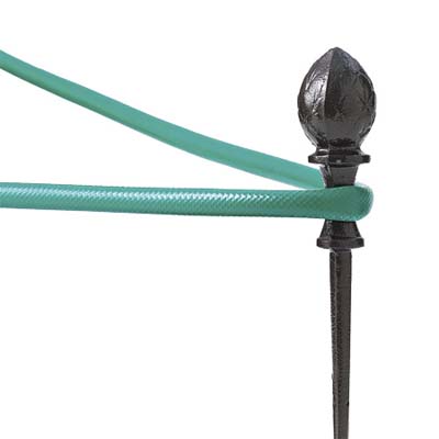 hose wrapped around finial-tipped guide 