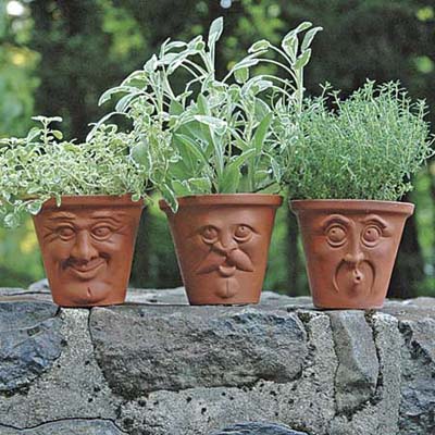 terracotta pots with molded faces
