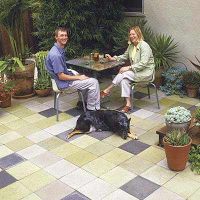 man and woman sitting on multi-colored patio