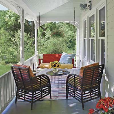 front porch with swing and outdoor pillows