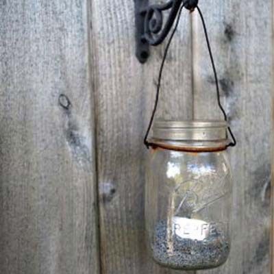 glass mason jar with tea light used as lantern