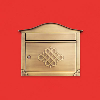 a stainless steel with antiqued-brass plating wall-mount mailbox