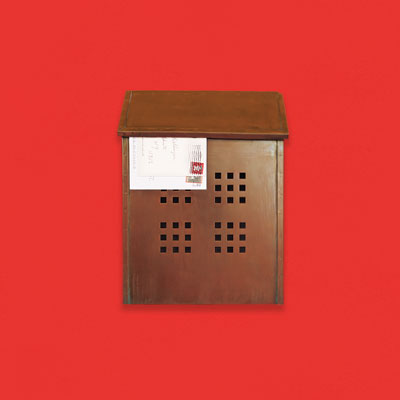 a solid brass wall-mount mailbox with an antiqued finish and decorative window grid