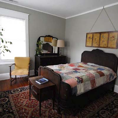 bedroom with gray walls and oriental rug