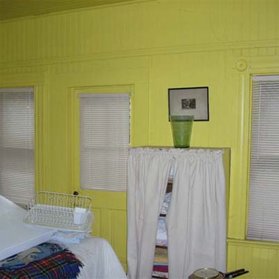 bedroom with bright yellow walls