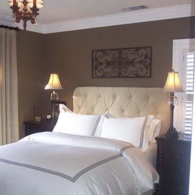 updated bedroom with tufted headboard and chocolate walls