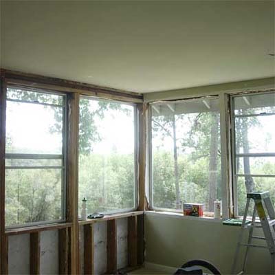 unfinished room with corner windows