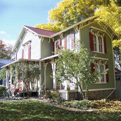 updated green and red victorian house