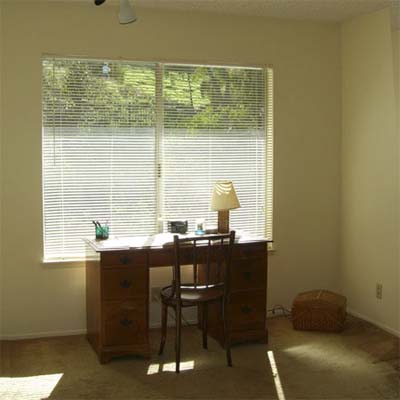 bare room with desk and chair