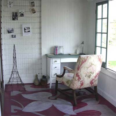 room with desk, chair and area rug