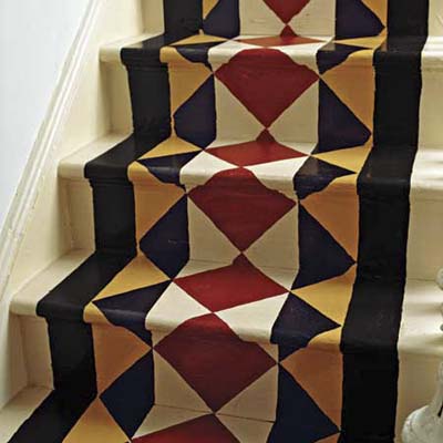 wood staircase with painted on stair runner