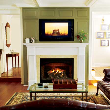 family room with gas fireplace in this remodeled greek revival