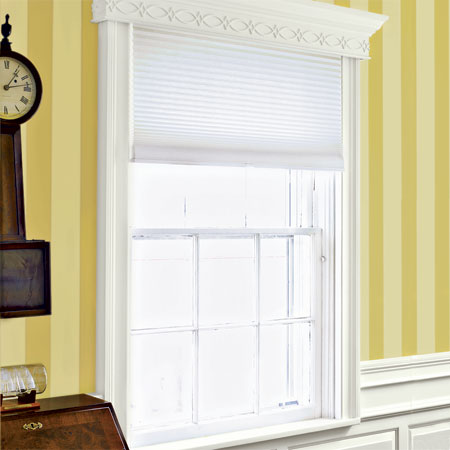stock windsor casing and built up cornices grace the windows in the master suite of this remodeled greek revival
