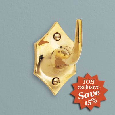 a one-pronged polished brass robe hook from Urban Archaeology