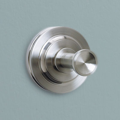 a round Deco style brass hook from Restoration Hardware with a satin nickel finish