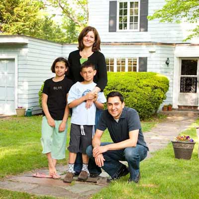 homeowner family before the exterior of the T O H auburndale house before remodel