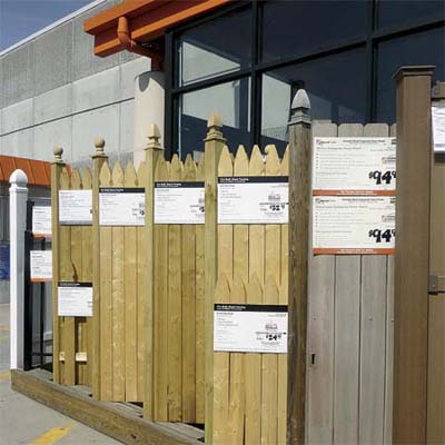 examples of off the shelf fence panels lined up outside a home hardware yard and  garden store