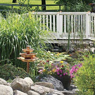 view of bridge in reader's finished pond garden