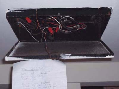 home inspection photo of hot wires in open junction box