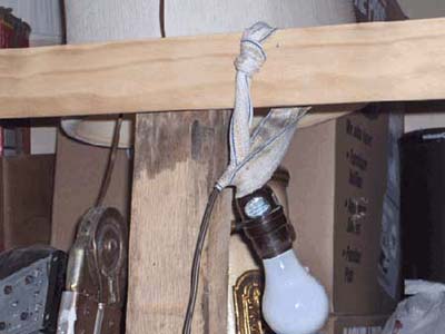home inspection photo of jock strap holding up light bulb in socket