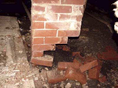 home inspection photo of chimney missing bricks