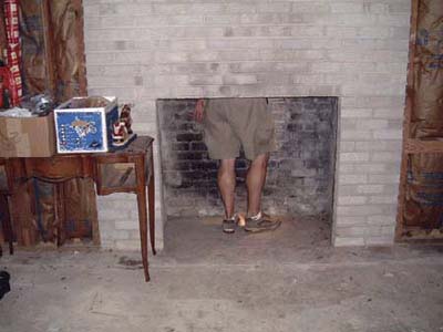home inspector inside a fireplace