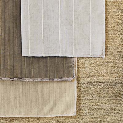 ErtheWeave fabrics, handwoven from natural fibers including linen, silk, and bamboo, then tailored into Roman shades, panel screens, curtains, cornices, and valances