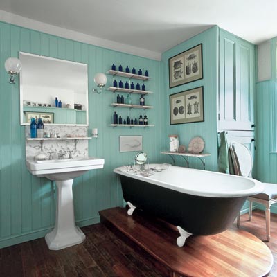 a turn-of-the-century vintage-style bath with soaking tub and wood floors