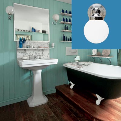 a turn-of-the-century vintage-style bath with wall-mounted sconce inset